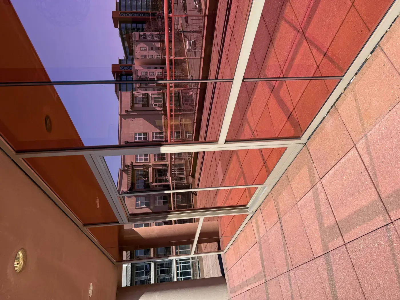 Clean commercial glass facade after pressure washing