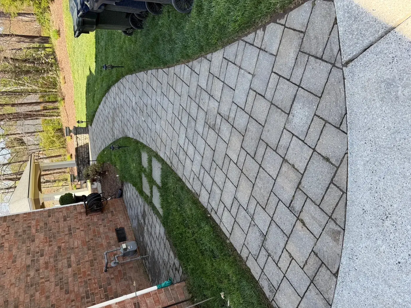 Clean brick paver walkway after pressure washing