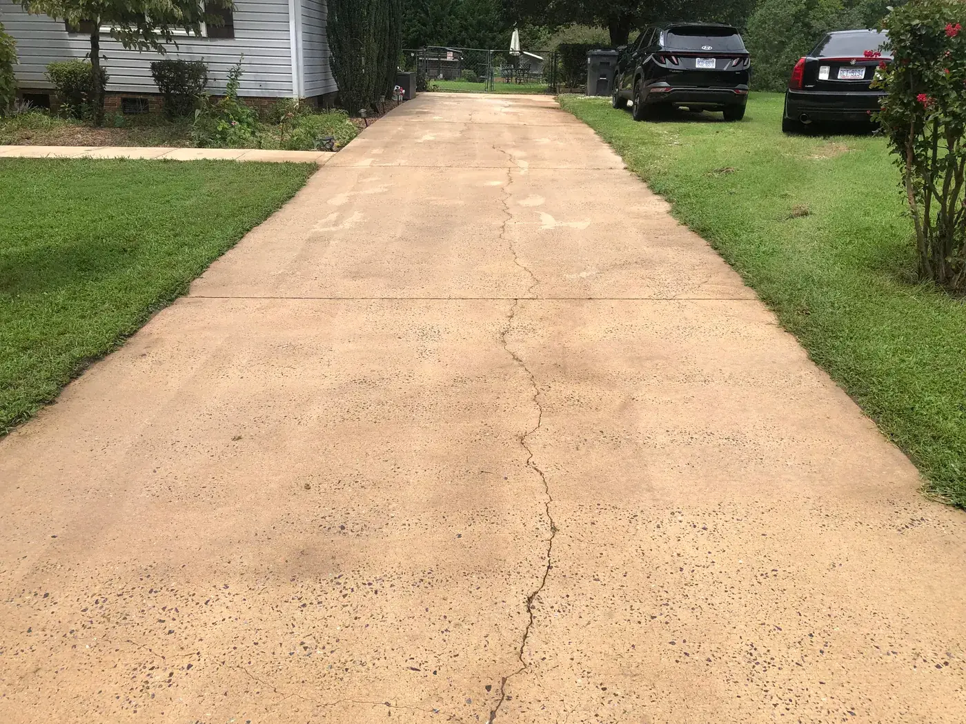 Long concrete driveway cleaned